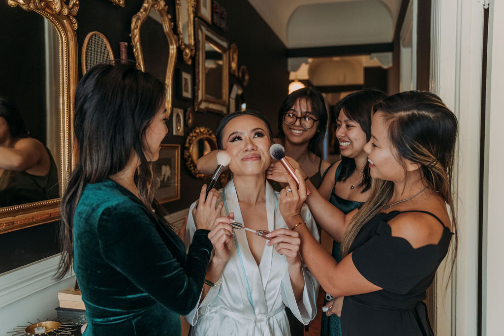 bride and bridesmaids getting ready