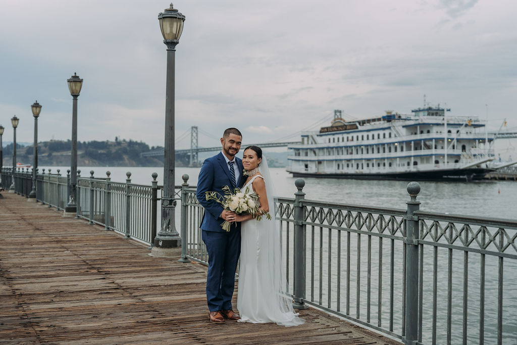 bride and groom on the pier in san francisco 